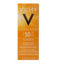 Crème solaire Vichy Capital Soleil SPF 50 posée sur une serviette de plage sous le soleil.